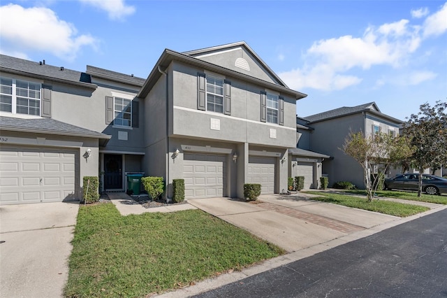 townhome / multi-family property featuring a garage