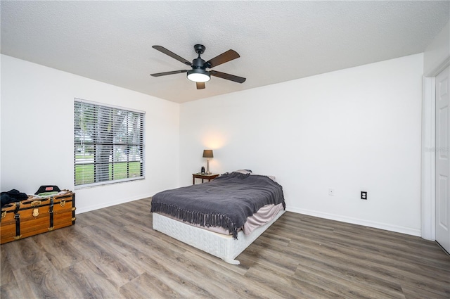 1171 Daimler Dr, Apopka, FL 32712 - bedroom featuring wood finished floors, baseboards, and ceiling fan