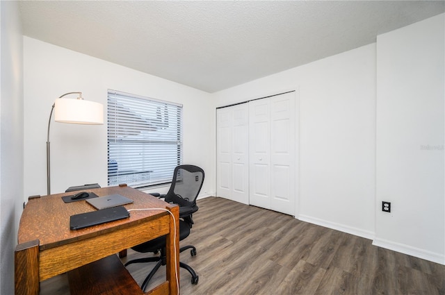 office featuring a textured ceiling and dark hardwood / wood-style floors