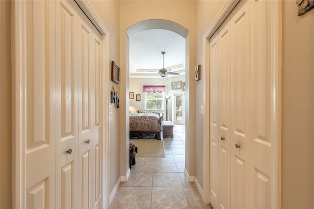 hall featuring light tile patterned flooring