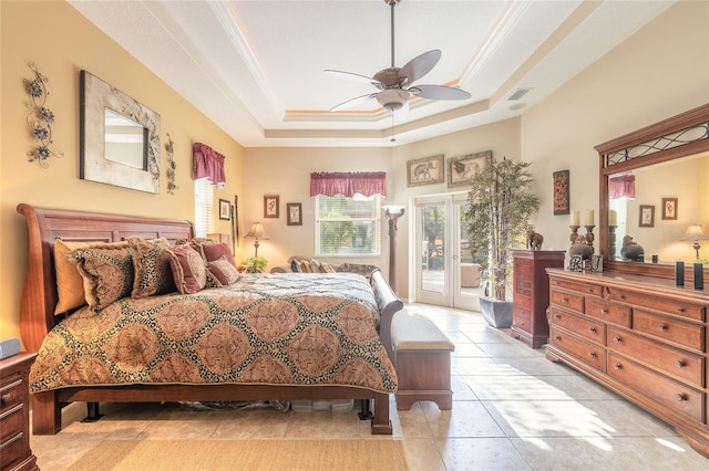 tiled bedroom featuring ornamental molding, access to outside, ceiling fan, and a tray ceiling