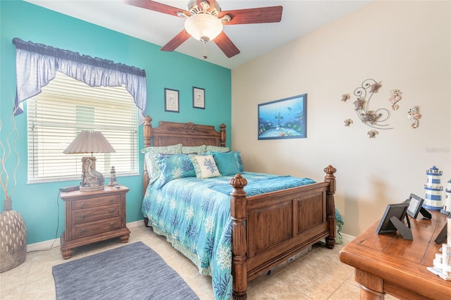 bedroom with ceiling fan and light tile patterned flooring