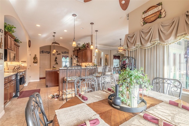 tiled dining room featuring ceiling fan