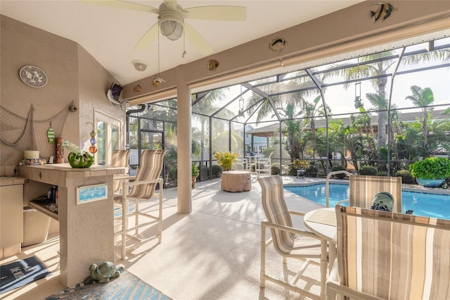 view of pool featuring ceiling fan