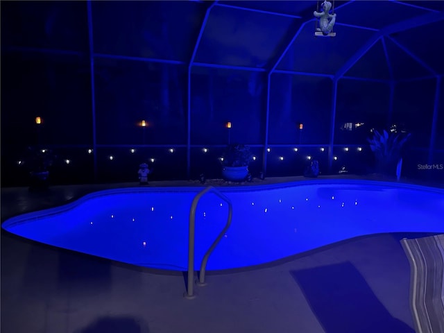 view of pool at night