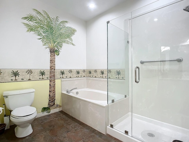 bathroom featuring toilet and shower with separate bathtub