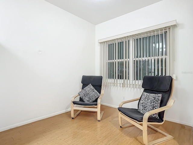 sitting room featuring wood-type flooring