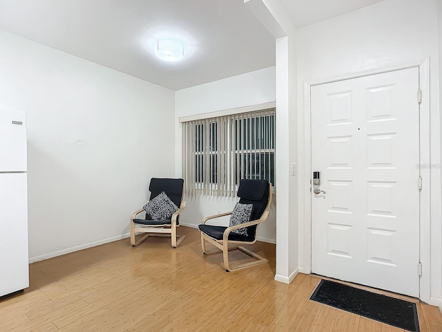 entryway with light hardwood / wood-style floors