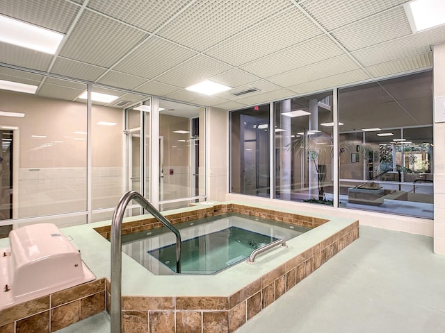 view of pool featuring an indoor hot tub