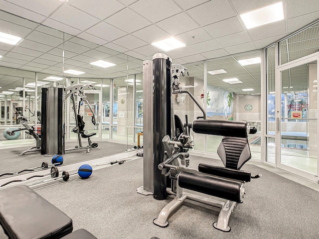 gym featuring a drop ceiling