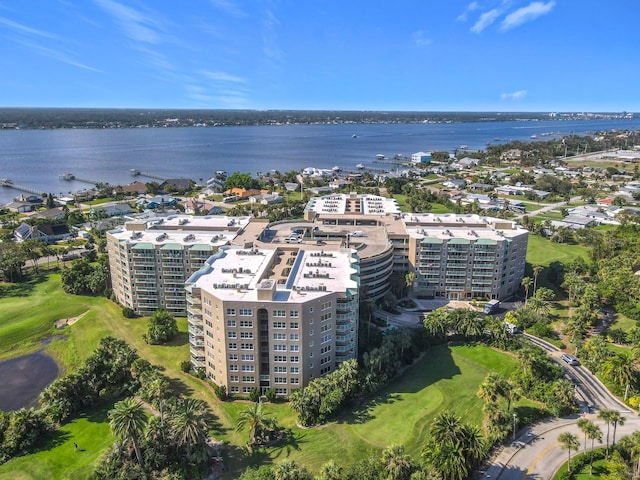 birds eye view of property with a water view