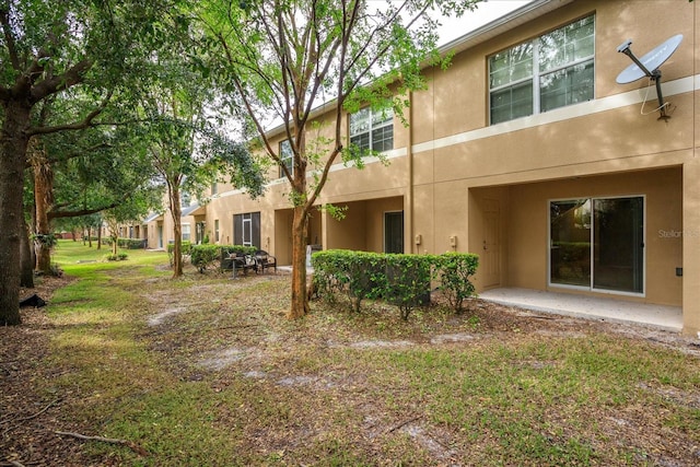 back of property with a patio area