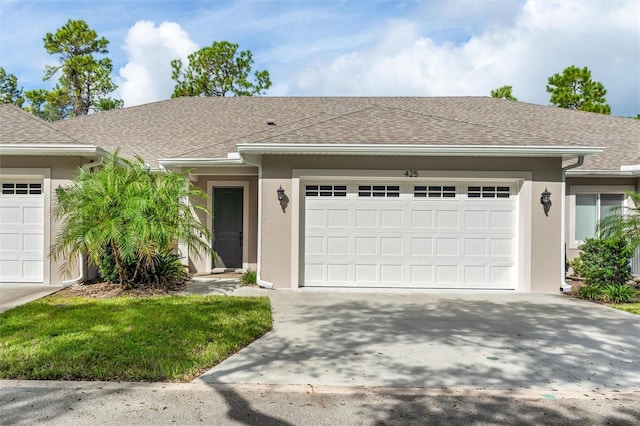 ranch-style house featuring a garage