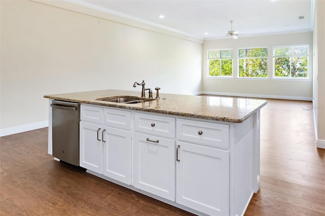 kitchen with crown molding, white cabinetry, sink, dark wood-type flooring, and a kitchen island with sink