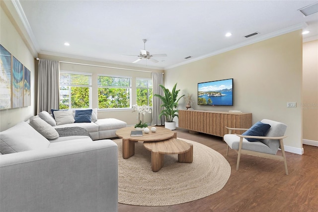 living room featuring hardwood / wood-style floors, ceiling fan, and ornamental molding