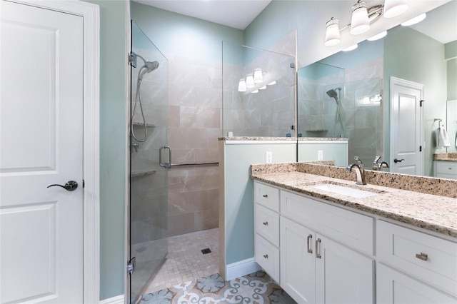 bathroom featuring walk in shower, tile patterned flooring, and vanity