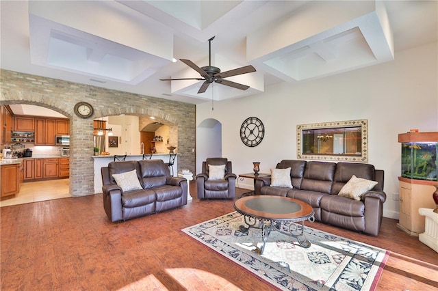 living room with light hardwood / wood-style floors and ceiling fan