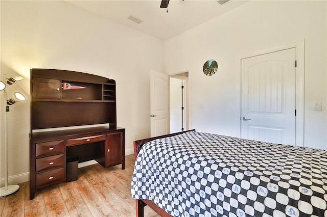 bedroom with light hardwood / wood-style floors and ceiling fan