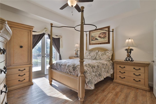 bedroom with french doors, access to outside, hardwood / wood-style flooring, and ceiling fan