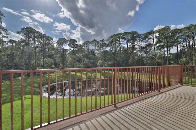 deck featuring a lawn