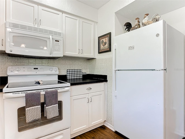 kitchen with white cabinetry, decorative backsplash, dark hardwood / wood-style flooring, and white appliances