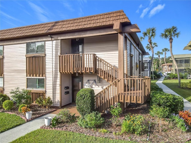 600 N Boundary Ave Unit 106D, Deland, FL 32720 - back of property with stairs and mansard roof