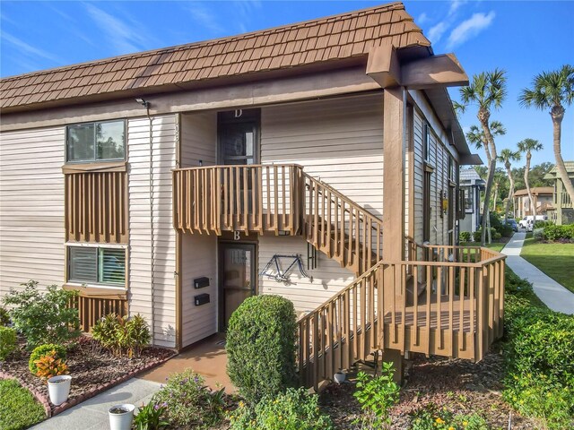 600 N Boundary Ave Unit 106D, Deland, FL 32720 - rear view of house featuring stairway
