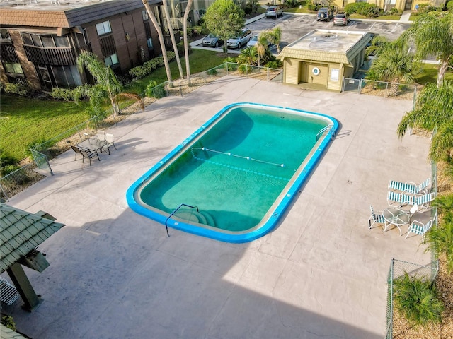 view of swimming pool featuring a patio area