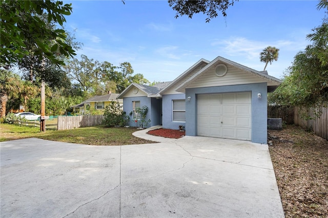 ranch-style home with a garage and a front yard