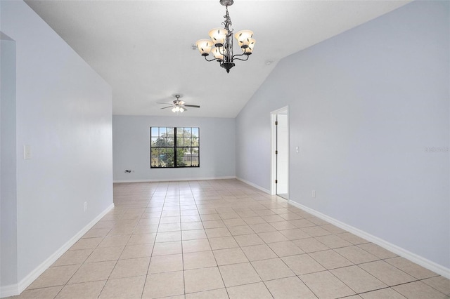 spare room with ceiling fan with notable chandelier, light tile patterned floors, and vaulted ceiling