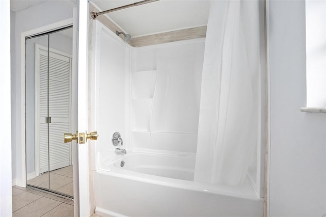 bathroom featuring tile patterned flooring and shower / tub combo with curtain