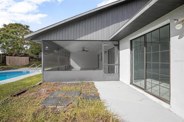 exterior space featuring a sunroom and ceiling fan