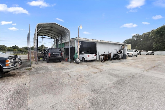 view of vehicle parking with a carport