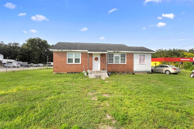 view of front of home with a front lawn