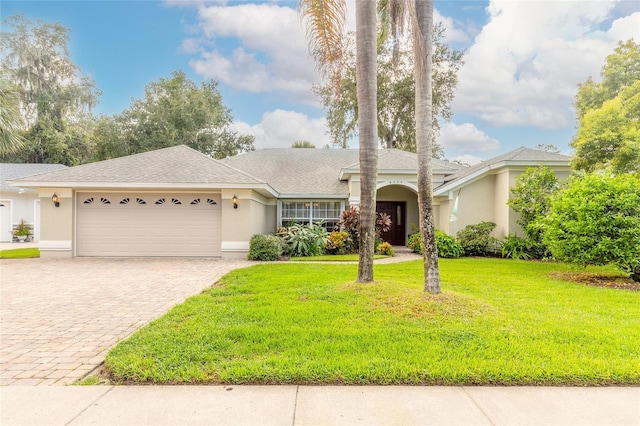 single story home with a garage and a front yard