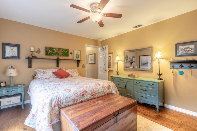 bedroom featuring hardwood / wood-style flooring and ceiling fan