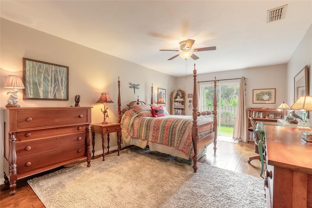 bedroom featuring access to outside, ceiling fan, and light wood-type flooring