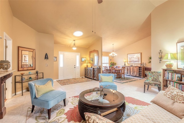 living room featuring a chandelier, light tile patterned floors, and high vaulted ceiling