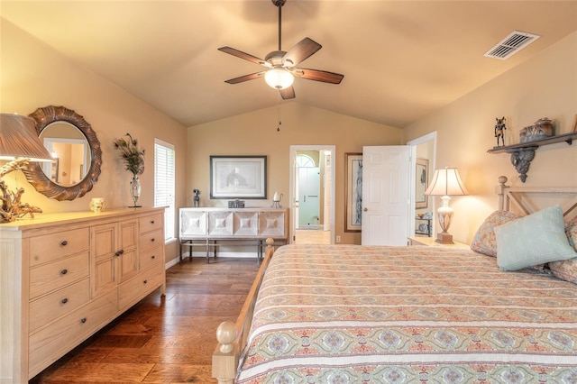 bedroom featuring ceiling fan, dark hardwood / wood-style floors, and vaulted ceiling