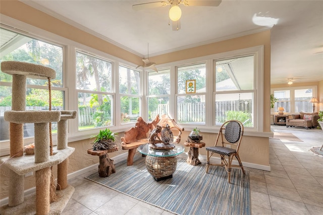 sunroom with ceiling fan and a healthy amount of sunlight