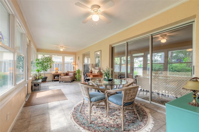 sunroom featuring a healthy amount of sunlight and ceiling fan