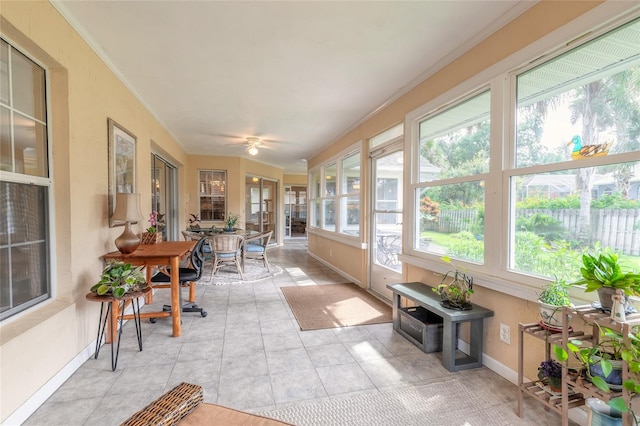 sunroom / solarium with ceiling fan