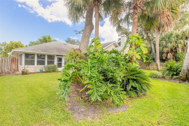 view of yard featuring a sunroom