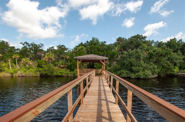 view of dock featuring a water view and a gazebo