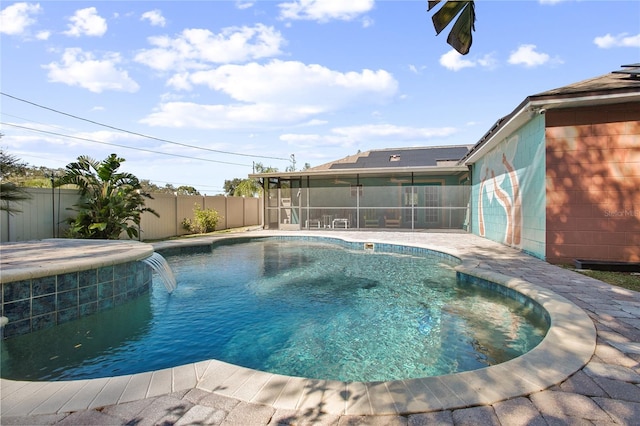 view of pool featuring a sunroom and pool water feature