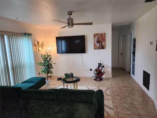 living room with tile patterned flooring and ceiling fan