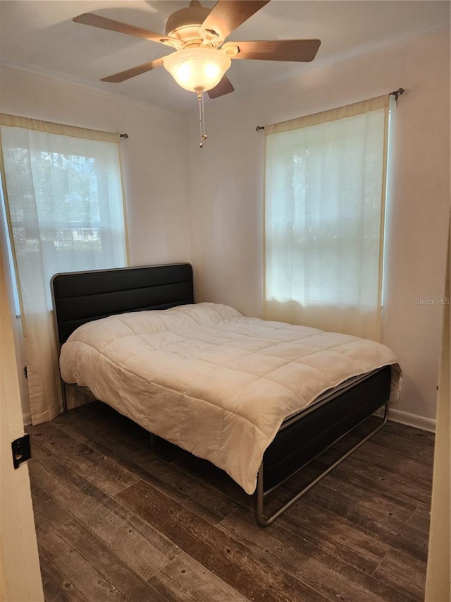 bedroom featuring dark hardwood / wood-style floors and ceiling fan