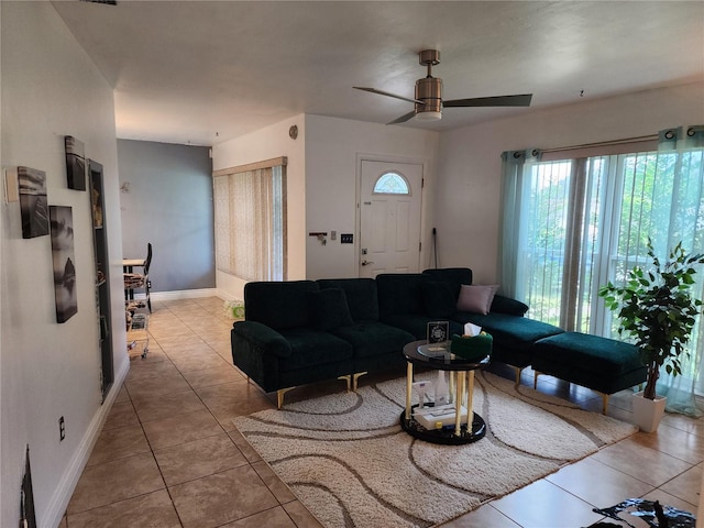 tiled living room featuring ceiling fan