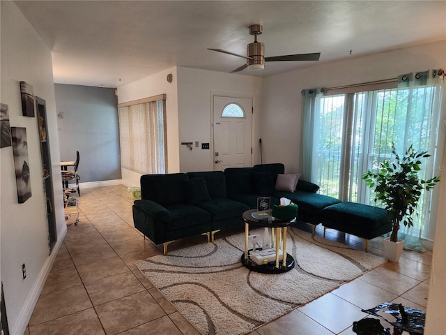 living room featuring ceiling fan and light tile patterned flooring