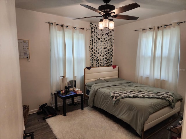 bedroom featuring ceiling fan and hardwood / wood-style flooring